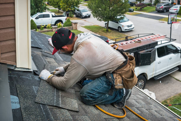 Professional Hail Damage Roof Repair technician working in Woonsocket, RI